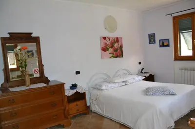 Letto o letti in una camera di Agriturismo LA TAVERNA DEL NONNO