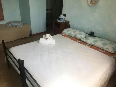 Letto o letti in una camera di Agriturismo LA TAVERNA DEL NONNO