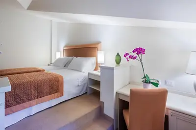 Letto o letti in una camera di Park Hotel Olimpia