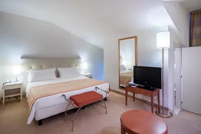 Letto o letti in una camera di Park Hotel Olimpia