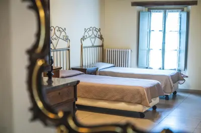 Letto o letti in una camera di Hotel La Tavola Rotonda