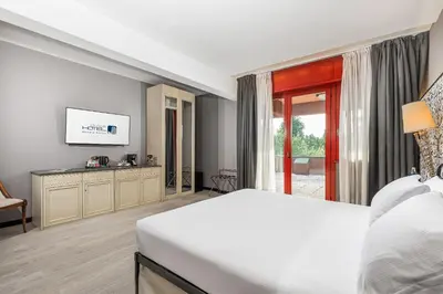 Letto o letti in una camera di City Style Hotel Reggio Emilia