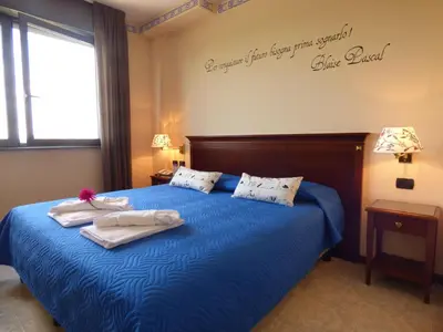 Letto o letti in una camera di Hotel Fidenza