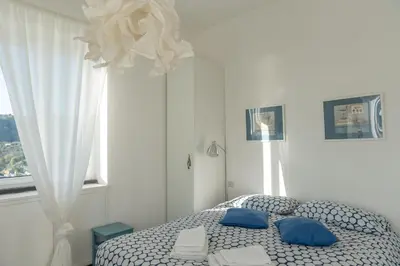Letto o letti in una camera di Cosy Apartment by PortofinoVip