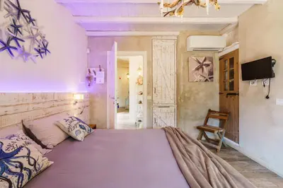 Letto o letti in una camera di La Rocca Maison de Charme