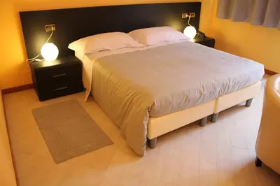 Letto o letti in una camera di Hotel Padus Meublè Parma