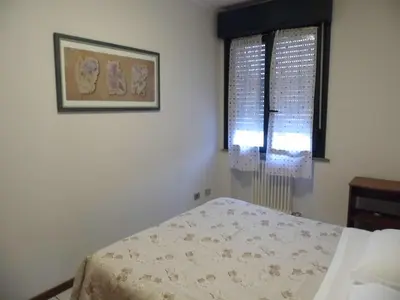 Letto o letti in una camera di Bilocale Mentana 21