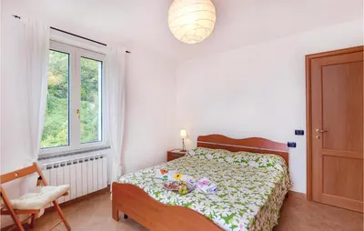 Letto o letti in una camera di Cozy Apartment In Localitabracco Ge