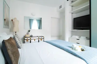 Letto o letti in una camera di Casa Giulia - Apartment beachfront with 2 bedrooms, air conditioning and private parking, just 30 meters from the beach