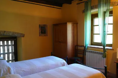 Letto o letti in una camera di Ai Chiosi affittacamere
