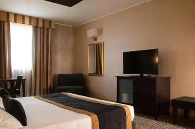 Letto o letti in una camera di Hotel Motel Del Duca-Pavia
