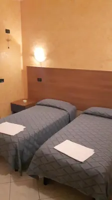 Letto o letti in una camera di Hotel Armida