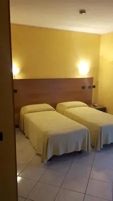 Letto o letti in una camera di Hotel Armida