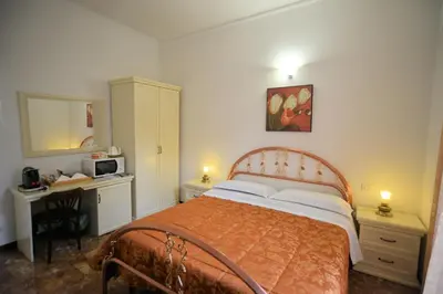 Letto o letti in una camera di Affittacamere Agata