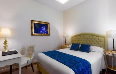 Letto o letti in una camera di Grand Hotel Salsomaggiore