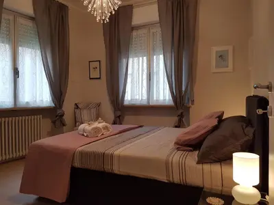 Letto o letti in una camera di Parma City Centre Holiday House