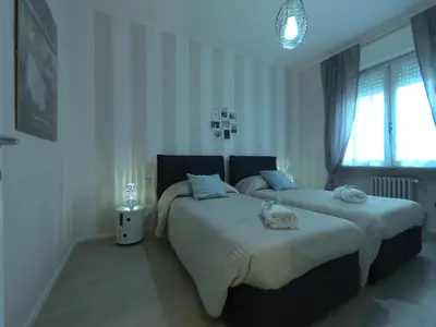 Letto o letti in una camera di Parma City Centre Holiday House