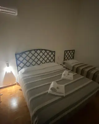 Letto o letti in una camera di Casa Bellodi