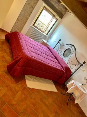 Letto o letti in una camera di Antica Corte Casa Marini