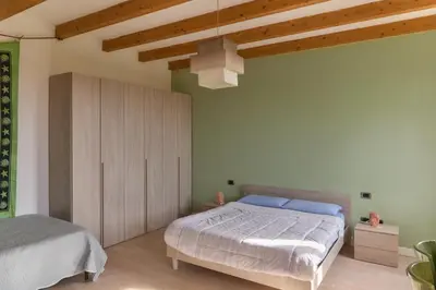 Letto o letti in una camera di Ca' Biscòtt