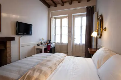 Letto o letti in una camera di Il Cortiletto