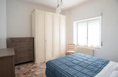 Letto o letti in una camera di Appartamento Arcobaleno