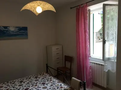 Letto o letti in una camera di Casa Angela