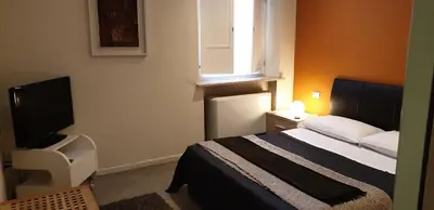 Letto o letti in una camera di Agorà Residenza