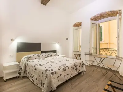 Letto o letti in una camera di Marymar