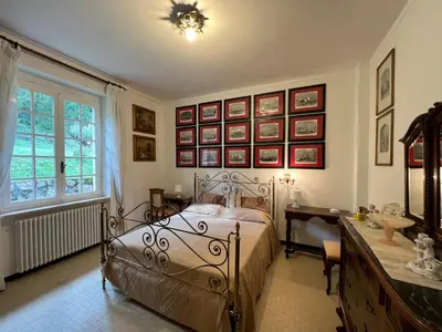 Letto o letti in una camera di Villa Gianna