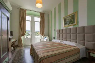 Letto o letti in una camera di Hotel Delle Rose