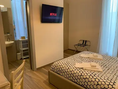 Letto o letti in una camera di Affittacamere Il Borgo