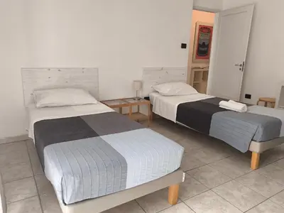 Letto o letti in una camera di LAB42 City & San Matteo Apartment - 2 Bedrooms