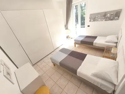 Letto o letti in una camera di LAB42 City & San Matteo Apartment - 2 Bedrooms