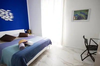 Letto o letti in una camera di La Casa del Vento