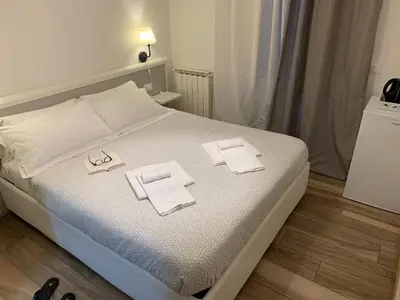 Letto o letti in una camera di Affittacamere LevantoMare