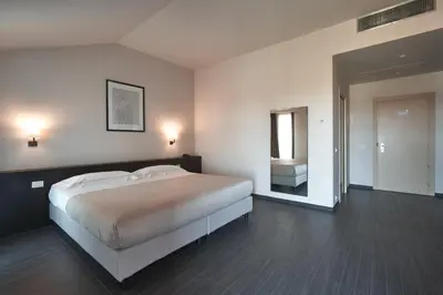 Letto o letti in una camera di Casalgrande Hotel