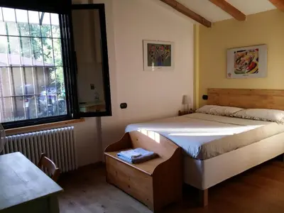 Letto o letti in una camera di R&B Albero Cavo Parma