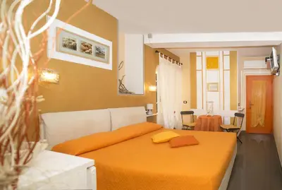 Letto o letti in una camera di I Coralli rooms & apartments