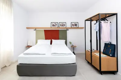 Letto o letti in una camera di BnBiz - Coworking Hotel