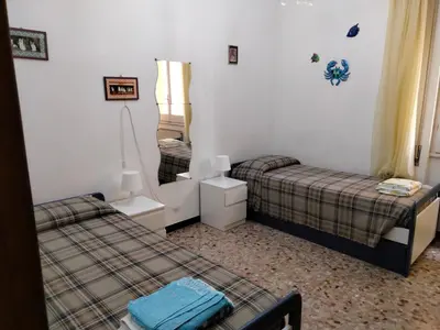 Letto o letti in una camera di Casa Massimo