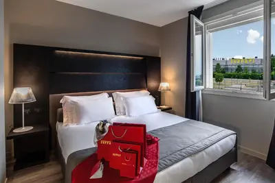 Letto o letti in una camera di Maranello Palace