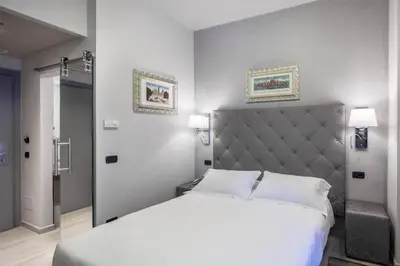 Letto o letti in una camera di Hotel Moderno