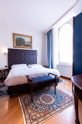 Letto o letti in una camera di Hotel Moderno
