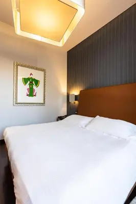 Letto o letti in una camera di Hotel Moderno