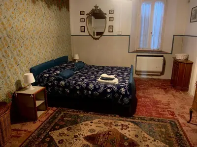 Letto o letti in una camera di Fattoria Amelia