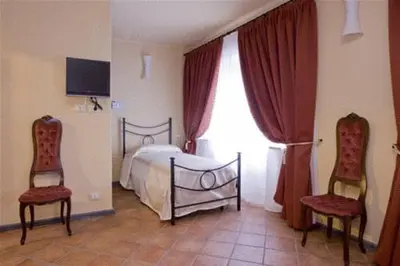 Letto o letti in una camera di La Campana D'Oro