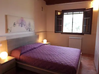 Letto o letti in una camera di Il Borgo di Tresana Casa Marina