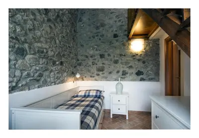 Letto o letti in una camera di Il Borgo di Tresana Casa Marina