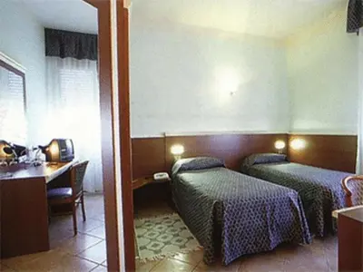 Letto o letti in una camera di Hotel La Maddalena